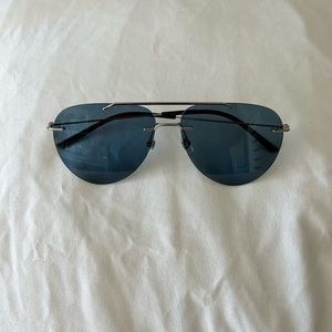 100% authentic frameless Gucci sunglasses.  New without case, tag and scratches